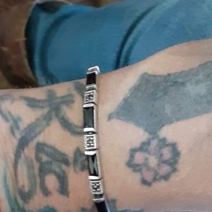 Black onyx and diamond cuts sterling silver bracel